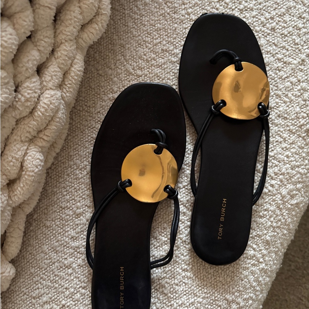 Tory Burch “Patos” Black and Gold Sandals